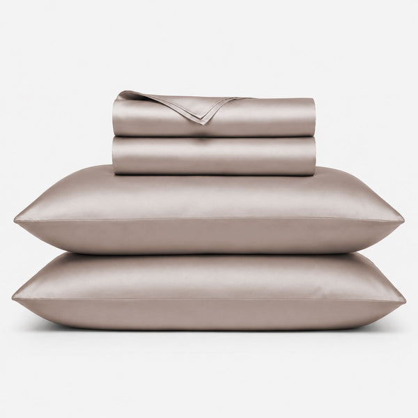 Stack of folded bamboo sheet sets in dune