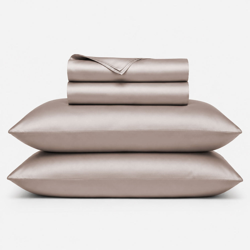Stacked 100% bamboo sheet sets in dune